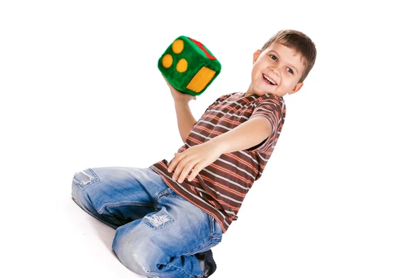 Happy boy holding blocks with numbers — Stock Photo, Image