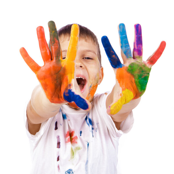 Little boy with hands painted in colorful paints ready for hand prints