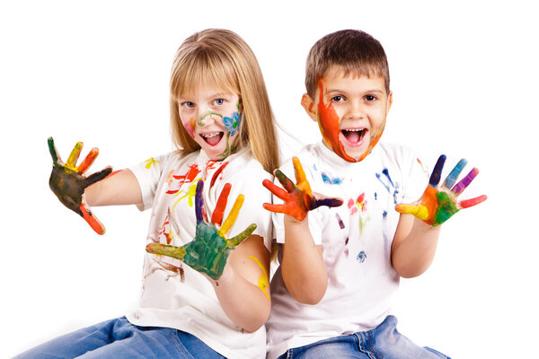Happy kids with hands painted in colorful paints