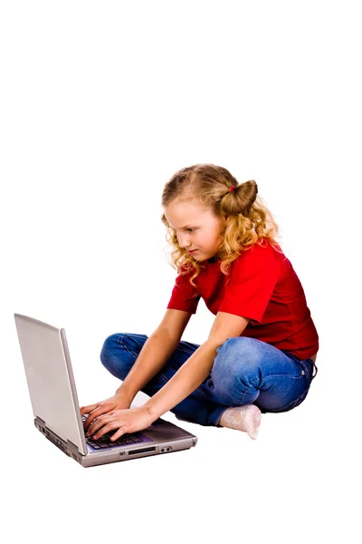 Girl playing computer game on laptop — Stock Photo, Image