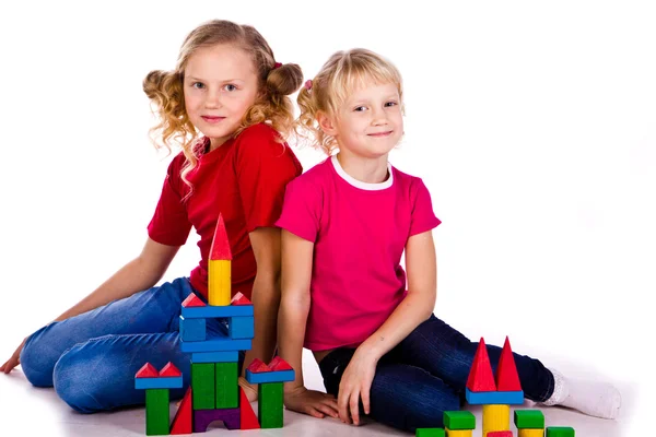 Children building a castle with cubes — Stock Photo, Image