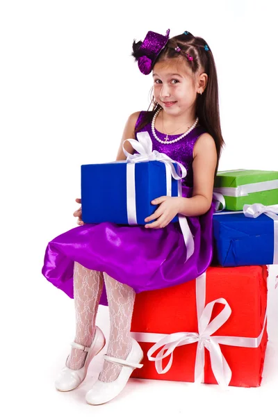Beautiful little girl with presents Stock Photo