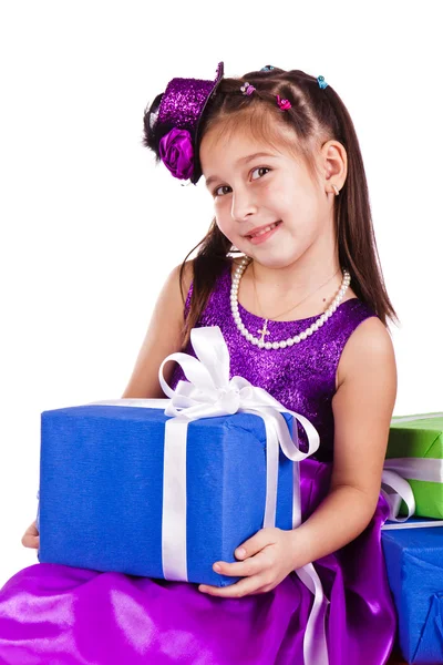 Beautiful little girl with presents Stock Picture