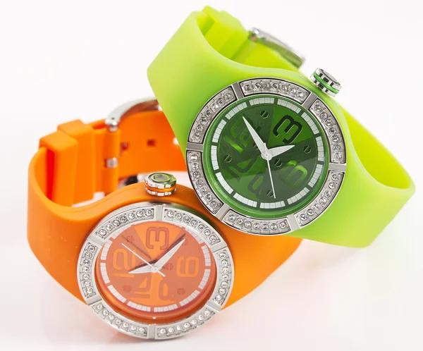 Relojes verdes y naranjas Imagen de stock