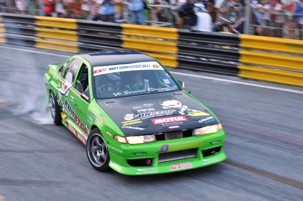 stock image BANGSAEN, THAILAND - FEB. 5 : Unidentified driver from ptt performa team drifting the car during the Bangsaen Thailand Speed Festival on february 5, 2012 in Ban