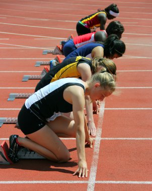 Girls on the start of the 100 meters dash clipart