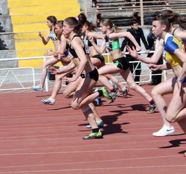 Girls on the 100 meters race clipart