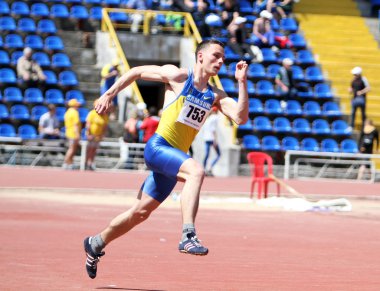 Cherkasenko Andriy compete in the high jump competition clipart