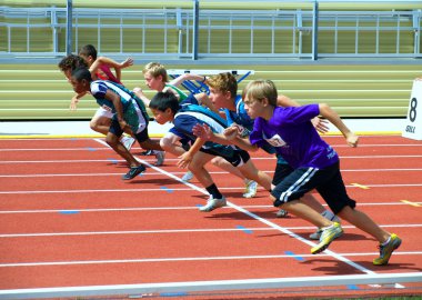 Boys on the start of the 100 meters dash. clipart