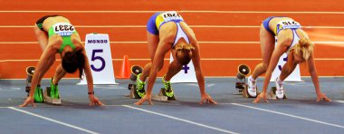 Girls on the start of the 60 meters dash clipart