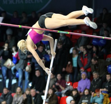 DONETSK,UKRAINE-FEB.11: Kolasa Agnieszka - Polish pole vaulter compete in the pole vault competition with the result 4.40 on Samsung Pole Vault Stars meeting on February 11, 2012 in Donetsk, Ukraine. clipart