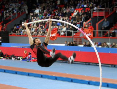 DONETSK,UKRAINE-FEB.11: BRAD WALKER - World Champion compete in the pole vault competition clipart