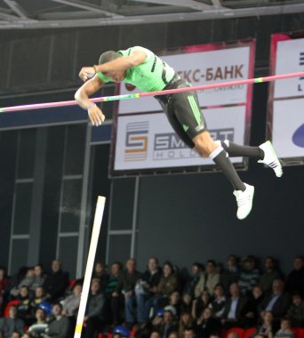 Borges Lazaro compete in the pole vault competition clipart