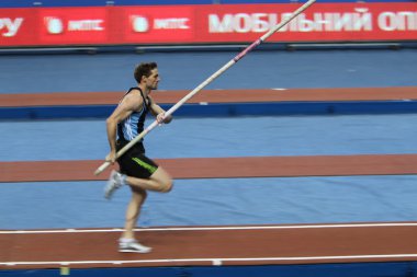 DONETSK,UKRAINE-FEB.11: Otto Björn wins second place in men's competition with the result 5.82 on Samsung Pole Vault Stars meeting on February 11, 2012 in Donetsk, Ukraine. clipart