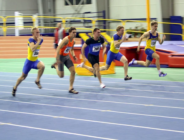 Unidentified men on the finish of the 60 meters dash — Stock Photo, Image