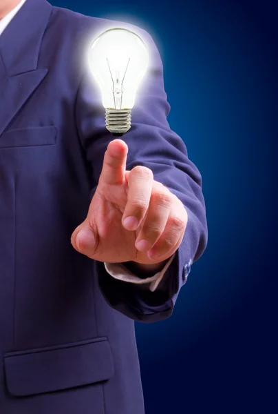 Hand pointing light bulb — Stock Photo, Image