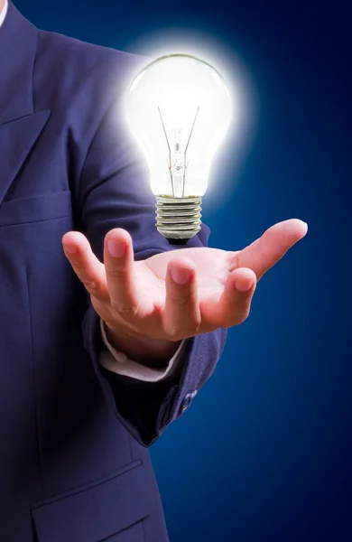 Light bulb on hand — Stock Photo, Image