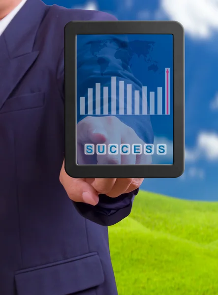 Hand pointing to success word on touch pad — Stock Photo, Image