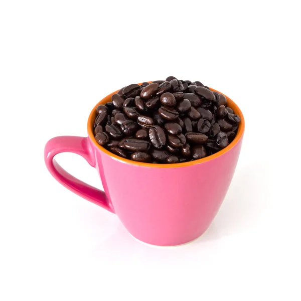 Coffee beans in pink cup — Stock Photo, Image