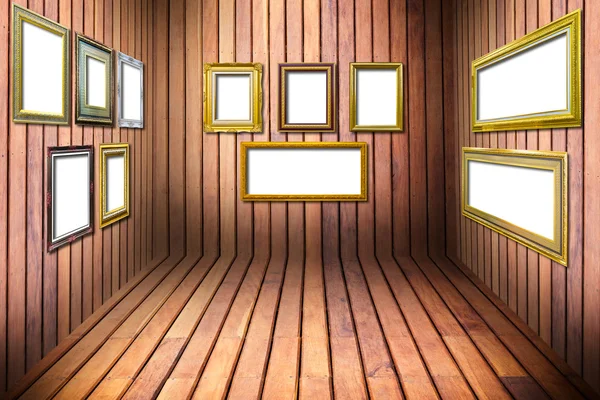 Marco de madera dorada en habitación de madera — Foto de Stock
