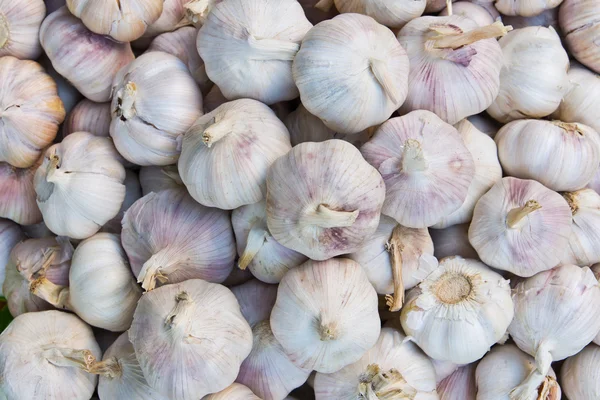 stock image Pile of garlic in market