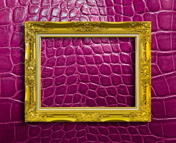 Frame of golden wood on purple leather with clipping path — Stock Photo, Image