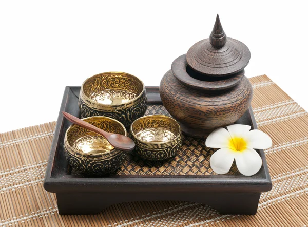 Thai carving brass and wooden bowl in wooden tray — Stock Photo, Image