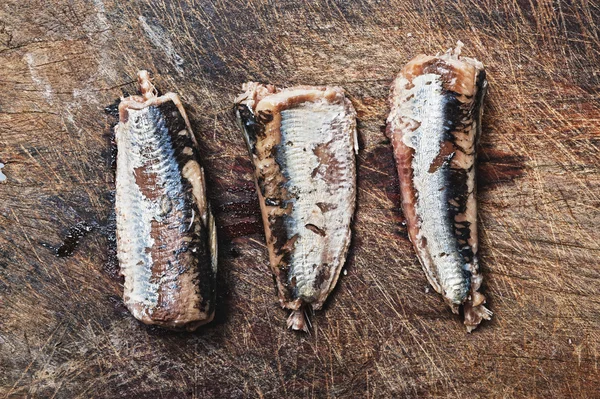 Fresh sardines on wooden background. — Stock Photo, Image
