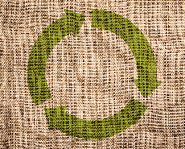 旧画布与绿色回收标志. — 图库照片