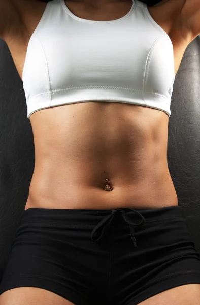 Close-up muscular woman abdomen Stock Photo