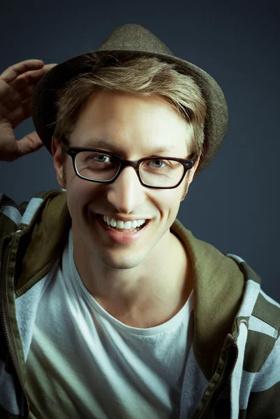 Handsome young guy posing with hat — Stock Photo, Image