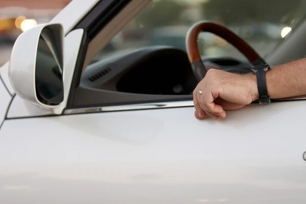 A drivers arm resting on the window — Stock Photo, Image