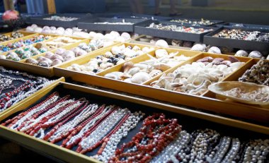 A stall of jewellery and shells clipart