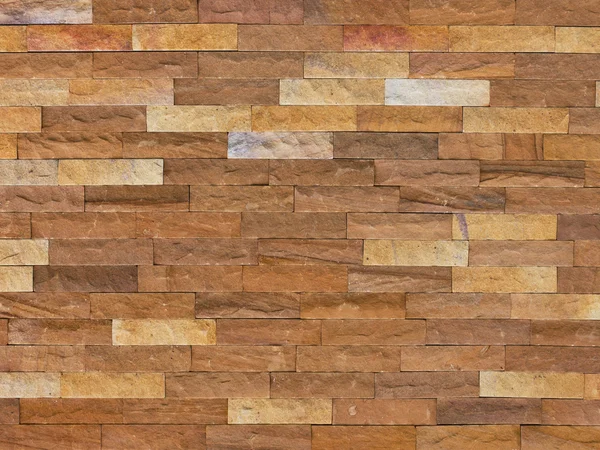Primer plano pared de ladrillo de piedra de arena — Foto de Stock