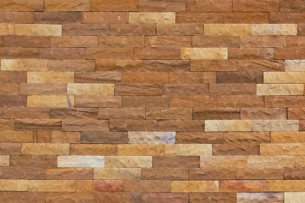 Primer plano pared de ladrillo de piedra de arena —  Fotos de Stock