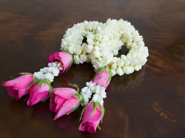 Stock image Garland of jasmine flowers on the table