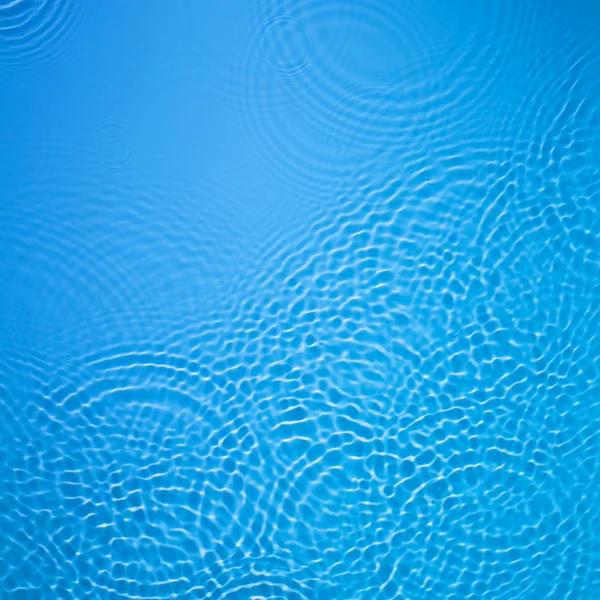 Latar belakang riak air lingkaran biru — Stok Foto
