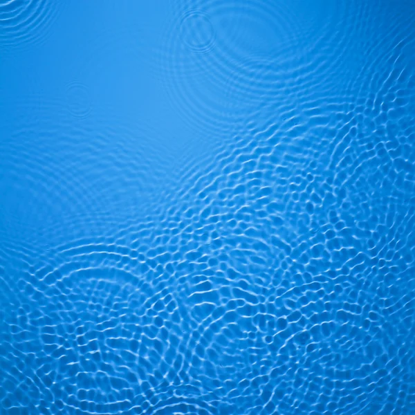 青い円水リップル背景 — ストック写真