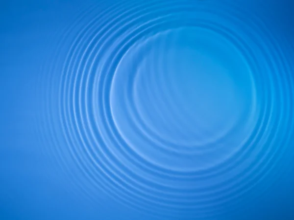 Niebieskie koło wody marszczyć tło — Zdjęcie stockowe