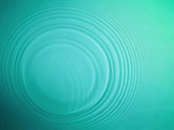 緑の円水リップル背景 — ストック写真