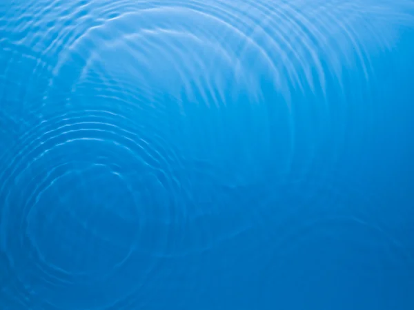 青い円水リップル背景 — ストック写真