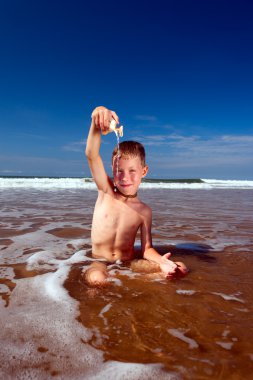 Boy on the beach clipart