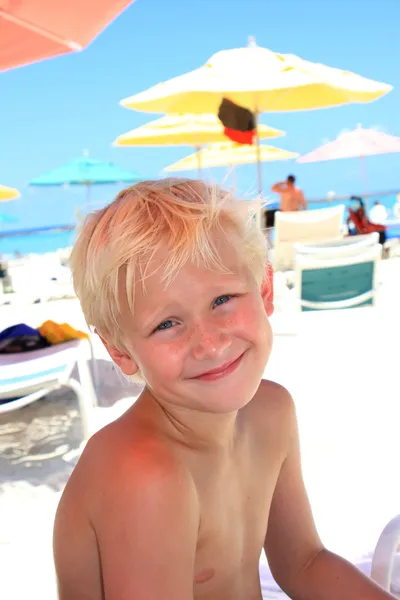 Seven year old blonde boy at the beach — Stock Photo, Image