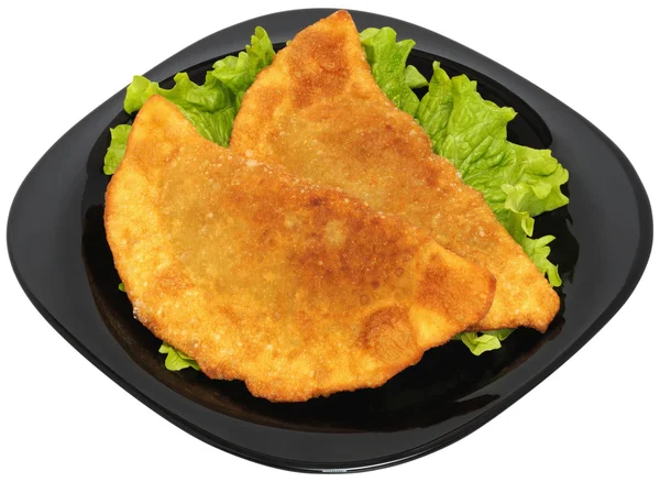 stock image Two Chiburekki on a sheet of Lettuce