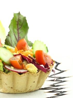 Vegetables salad in the waffle bowl clipart