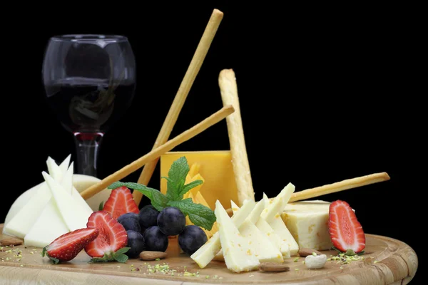 Cheese platter with fruits and nuts — Stock Photo, Image