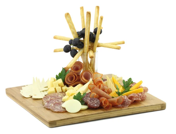 Deska lahůdky maso se sýrem a grissini — Stock fotografie