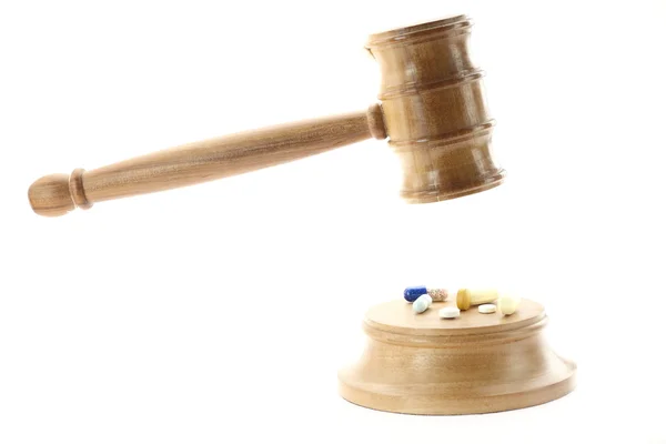 Pills and law — Stock Photo, Image