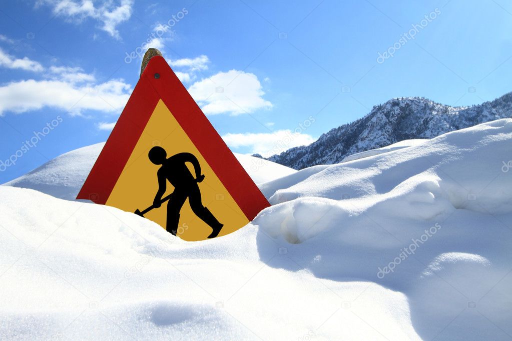 Under construction sign on snow