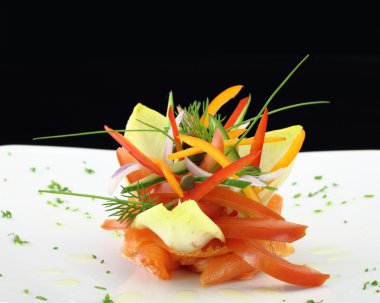 Gourmet dish. Smoked salmon with vegetables clipart